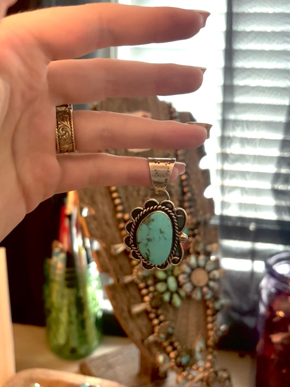 Royston turquoise pendant by Gilbert Nez